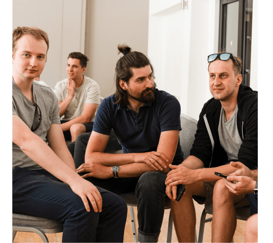 Men sitting and talking in a conference room